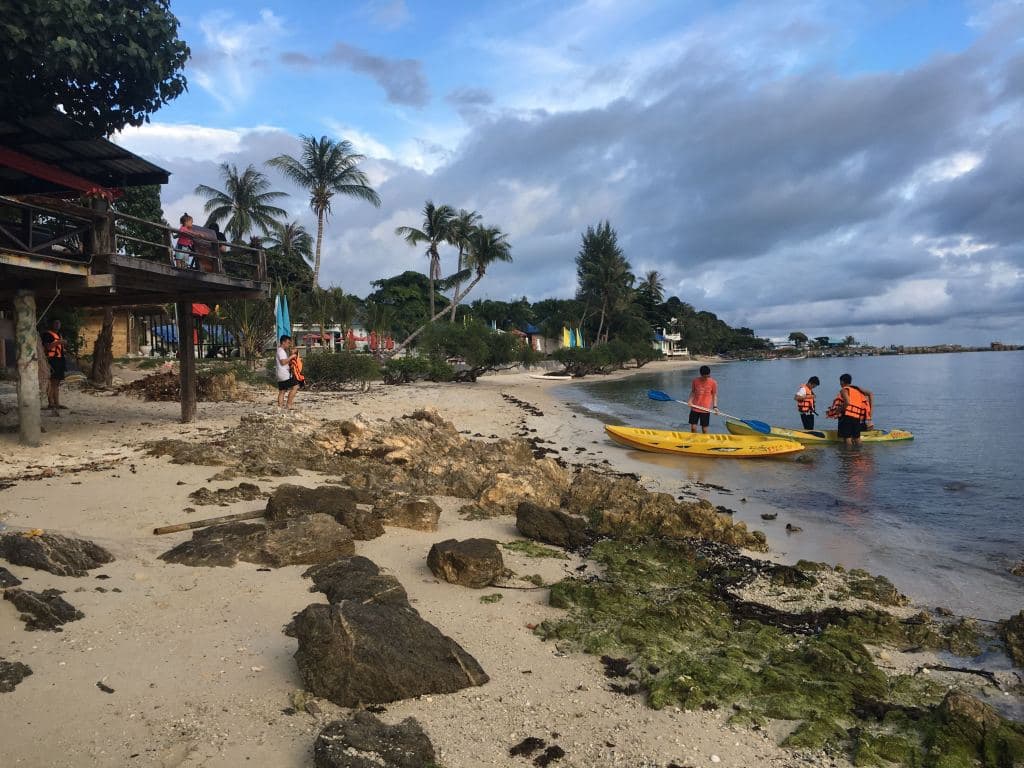 Sunset Beach, Had Rin, Koh Phangan, Thai boys kayaking