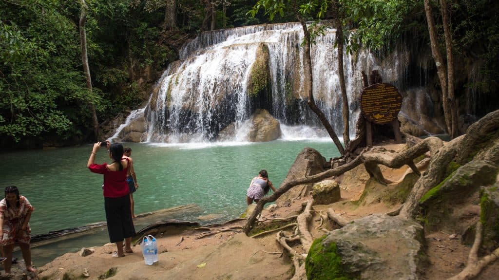 People taking photos at erawan waterfall