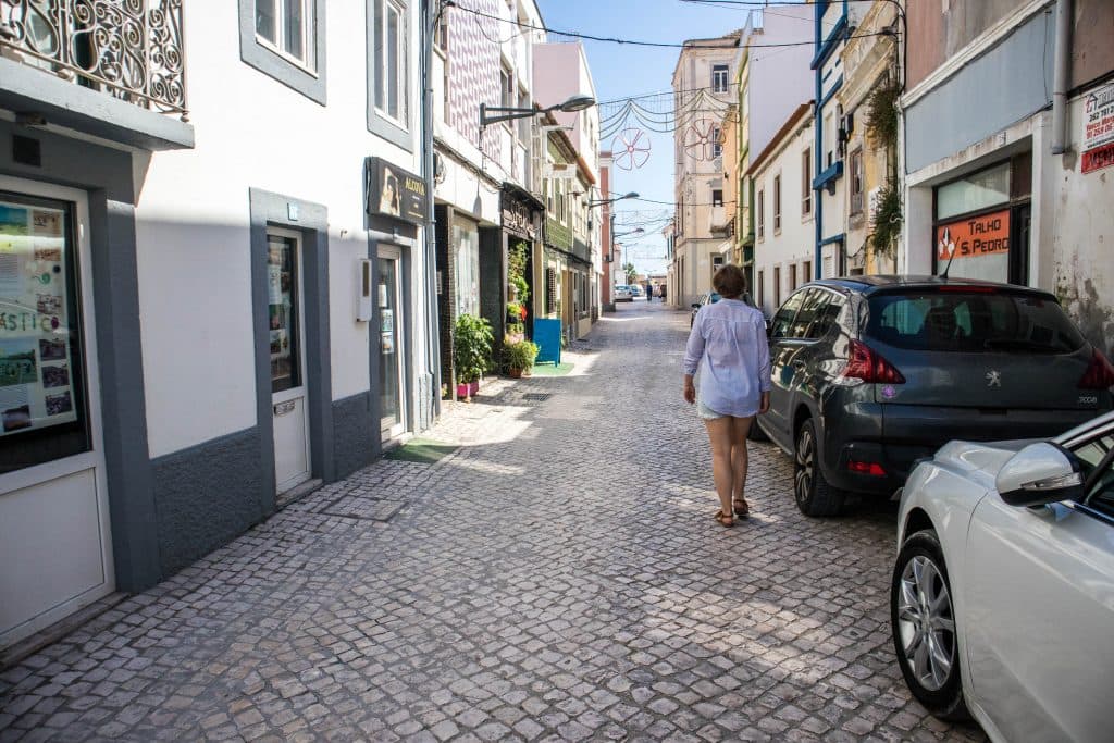 joanna walking on the streets in peniche, portugal 