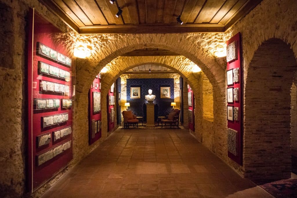 long, dark corridor with art at Quinta de Bacalhôa in Azeitao