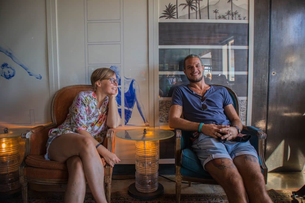 joanna and wolfgang are sitting in a bar in lx factory