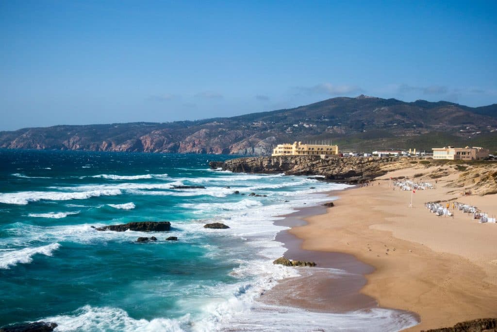 huge waves at the shore of guincho beach 