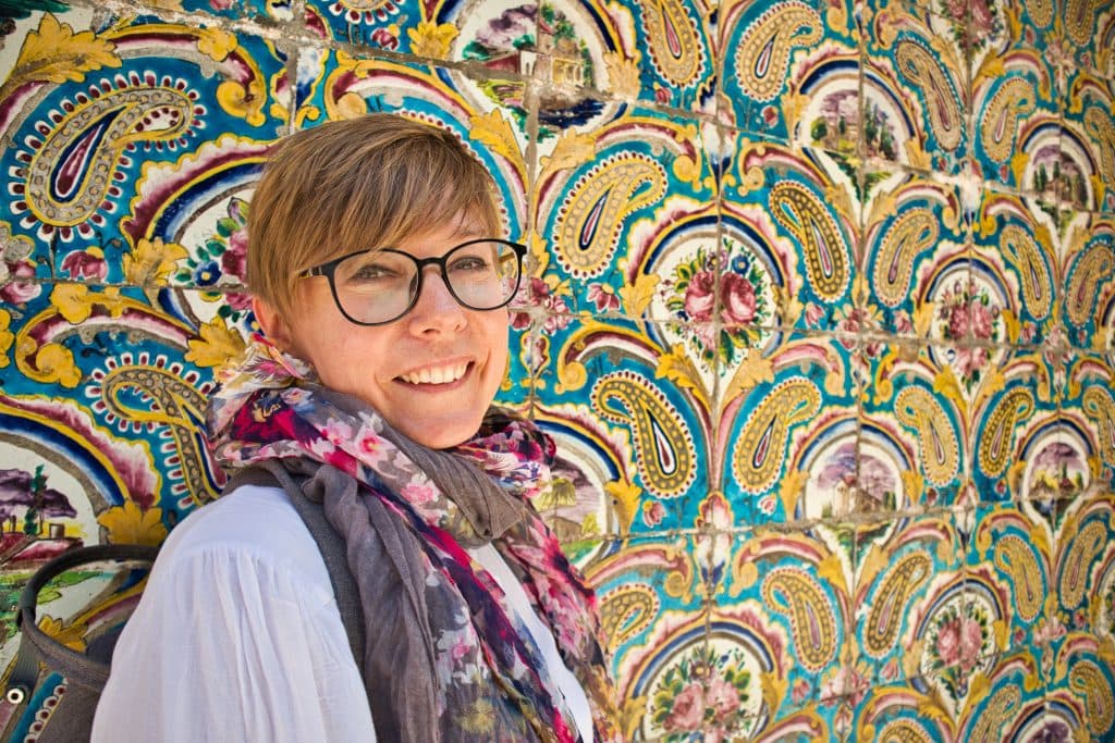 a girl with a beautiful wall in iran