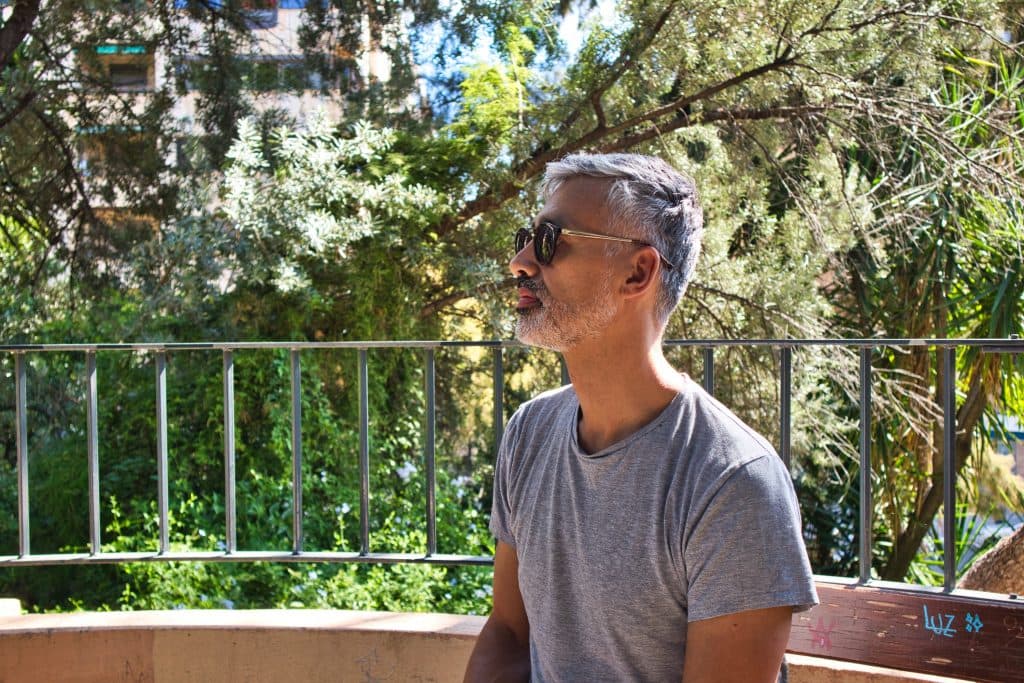 a man sits in a park and thinks in valencia, spain