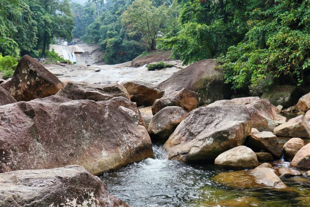 The promlok waterfall seen from the lowest level with water streaming through the rocks. 