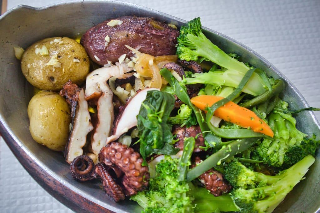 octopus on a plate at a tasca in lisbon. 