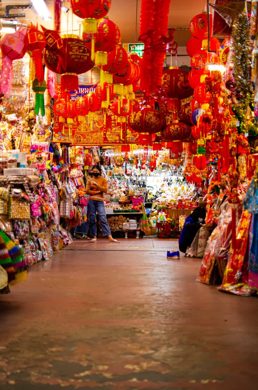 Red Chinese lanterns hanging down the ceiling at a market in Chiang Mai. 
