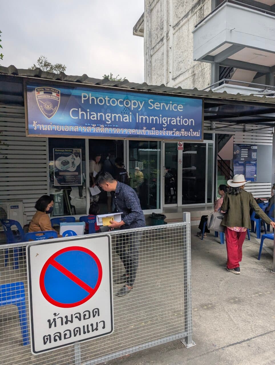 An office with people sitting outside in Chiang Mai. 