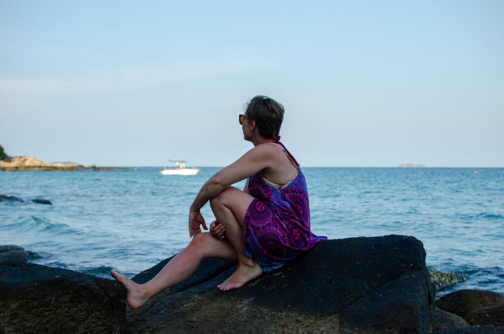 Joanna sitting on a rock, Koh Samet