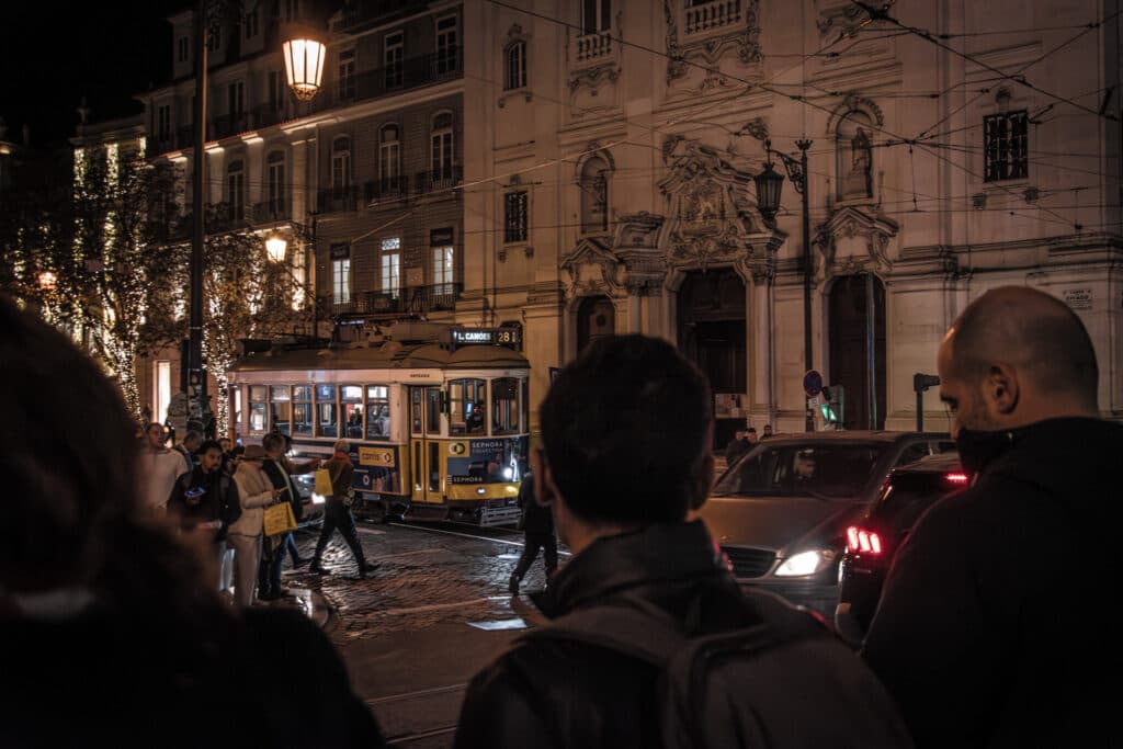 Lisbon at night, the centre of Lisbon with crowds and tram passing