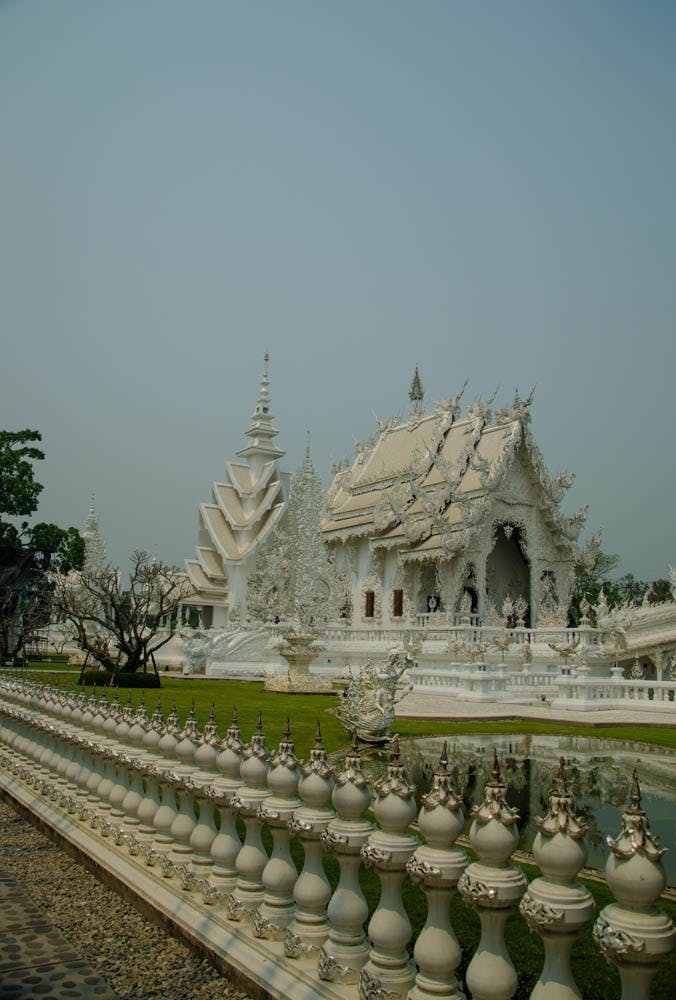 visiting the white temple in chiang rai. the main temple building seen from the outside 