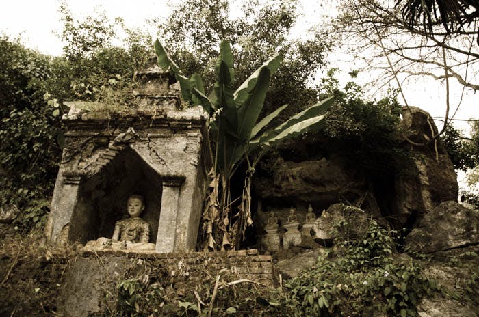 temple ruins and old buddha statue near chiang dao cave, thailand 