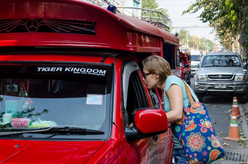 Jo explains a songthaew driver where we want to go.