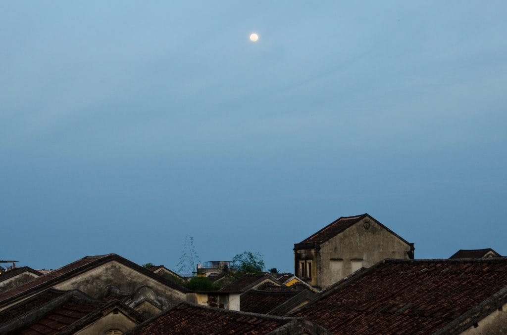 View over the roofs of Hoi An with full moon in the sky