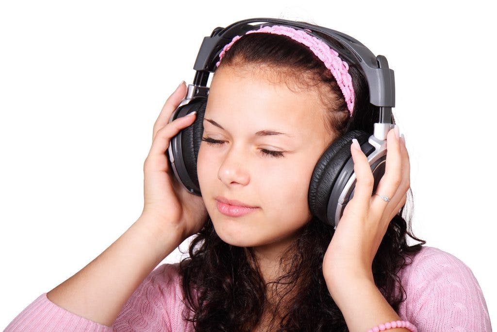 cute girl listening to music 