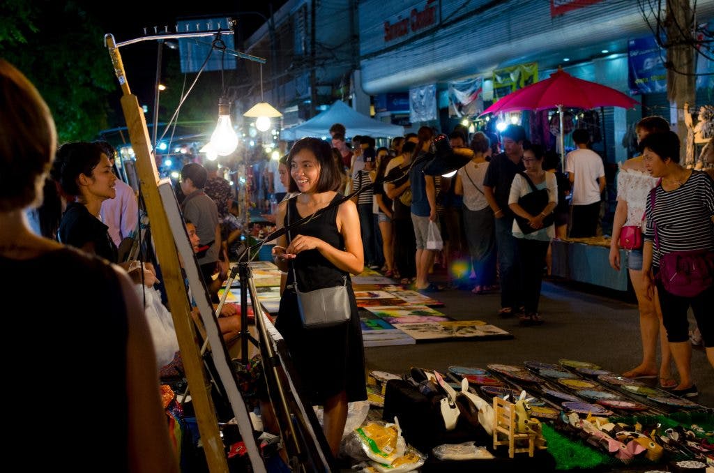 Shopping for paintings by local artists at the Sunday Night Market in Chiang Mai
