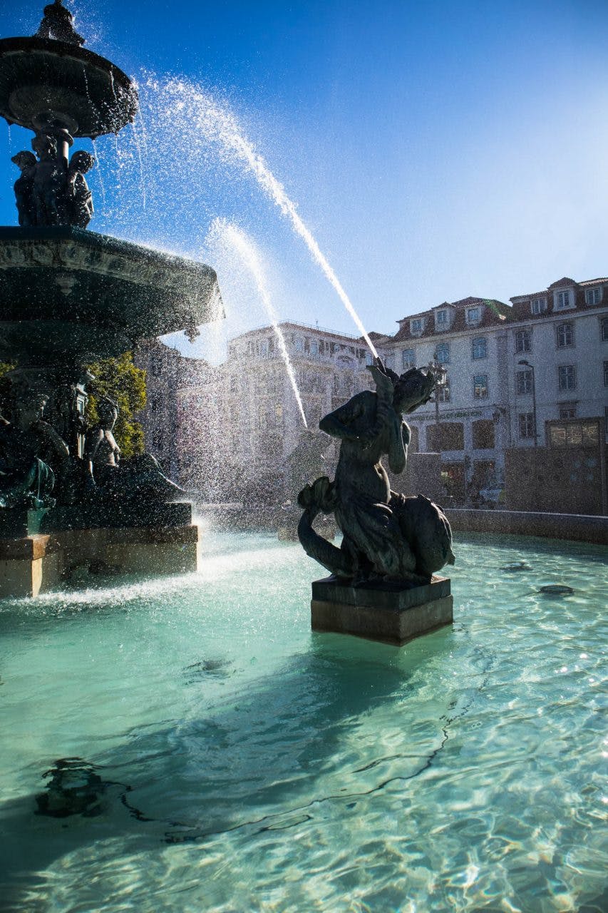 a sculpture in the fountains on rossio square in lisbon 