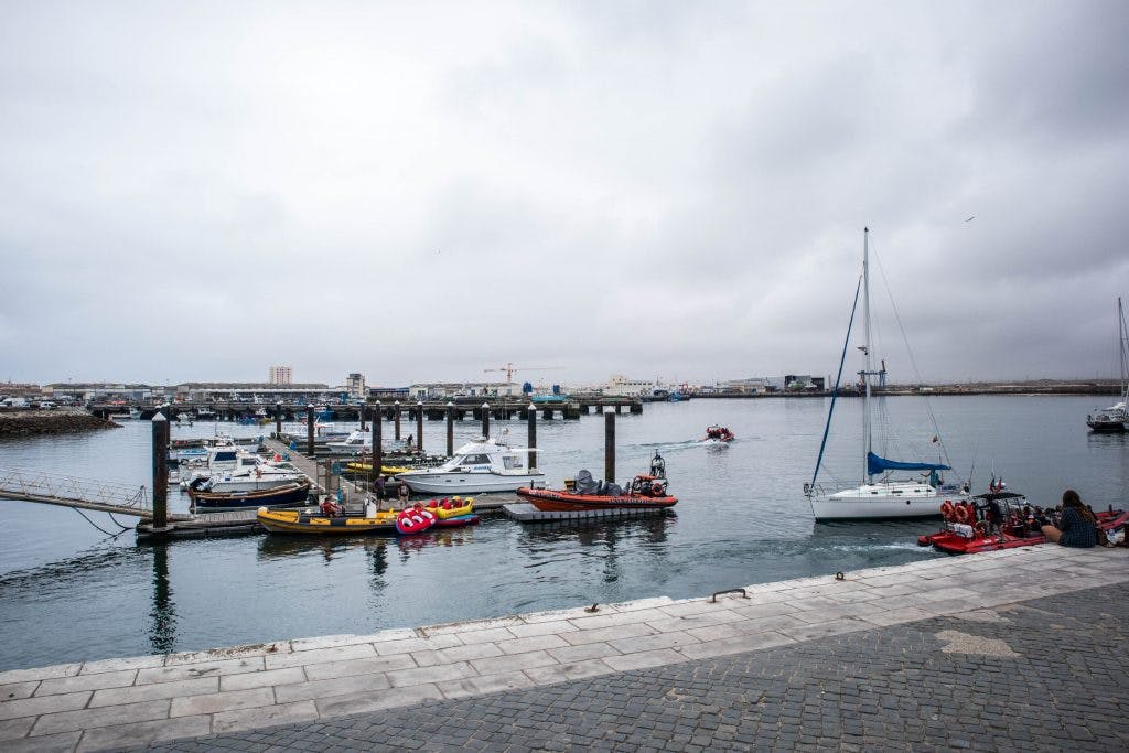 small port with a few boats in peniche, portugal 