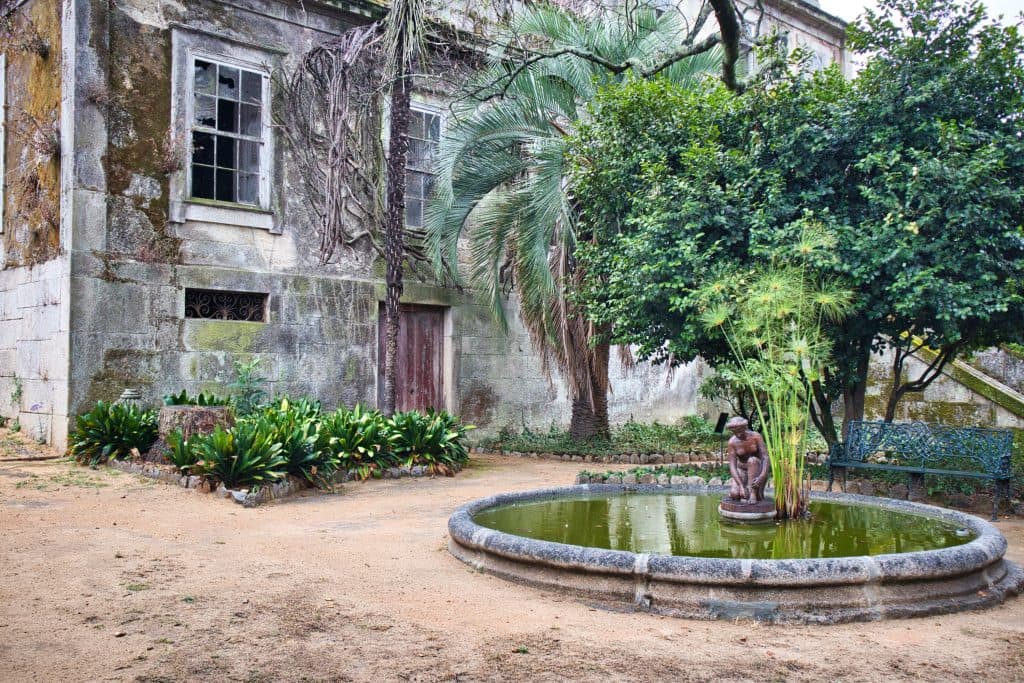 parque da quinta da devesas, porto, portugal, a little fountain and a big villa in a small park in porto