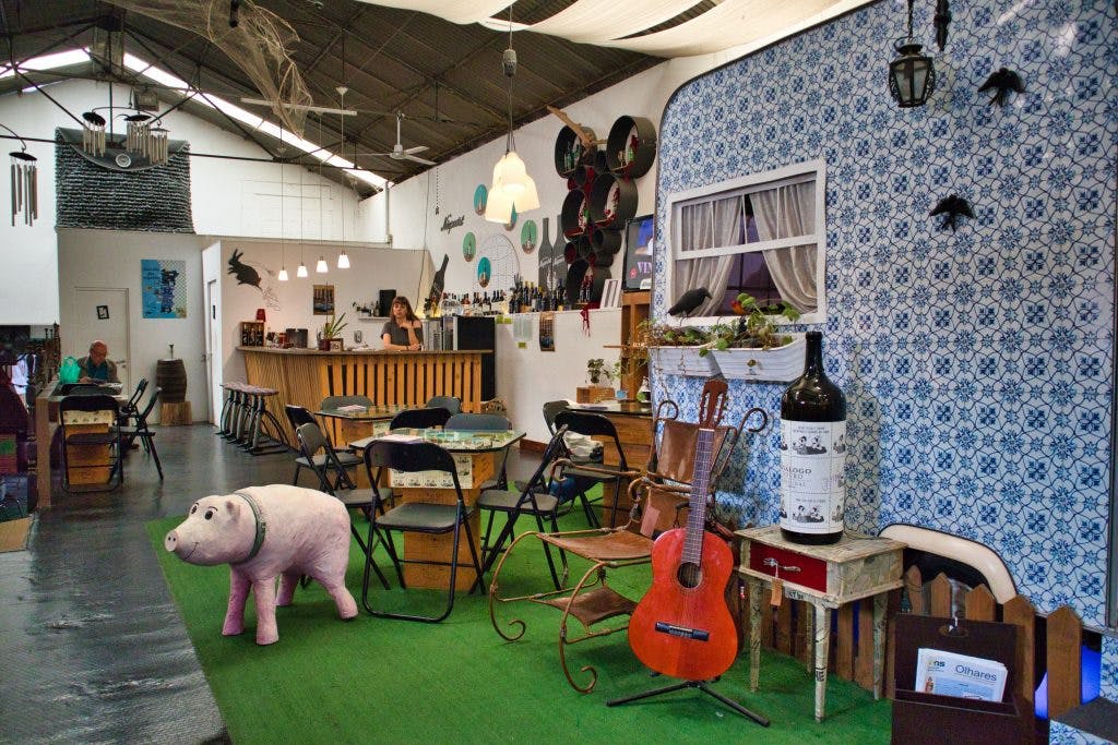 the interior of arte 3+ with a camper and a bar in vila nova de gaia, porto, portugal