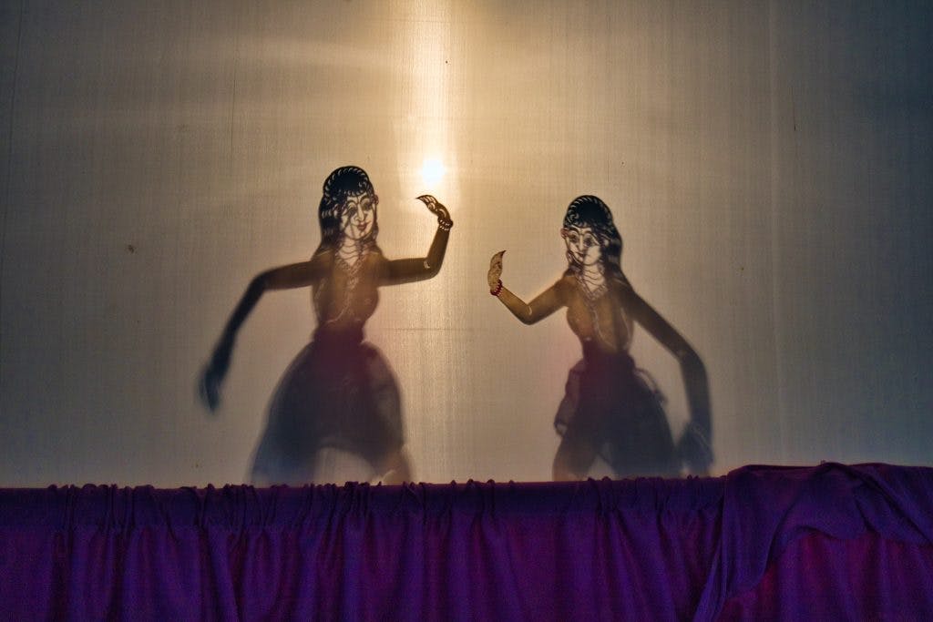 two shadow puppets in the puppet theatre in nakhon si thammarat in thailand 