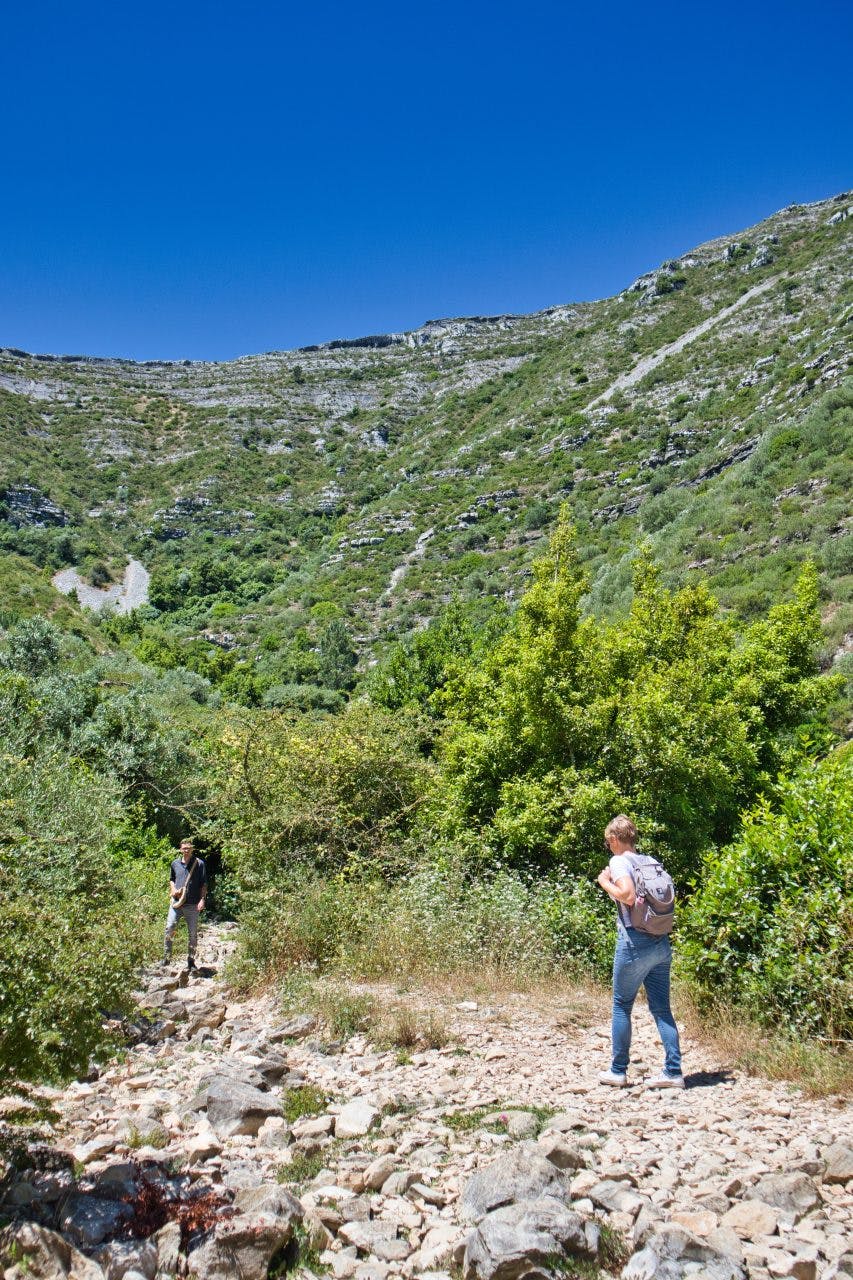 a woman and a man trekking in a natural park in portugal 