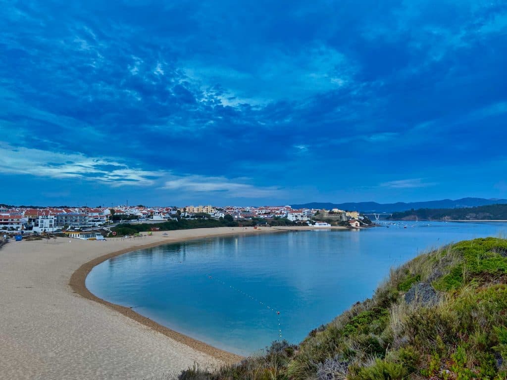 Vila Nova de Milfontes seen from a hill in the evening.
