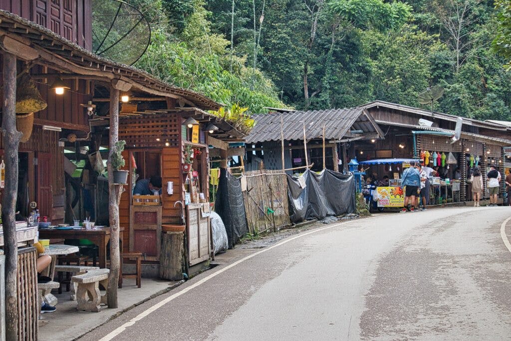 wooden houses on the road in the mae kampong village.