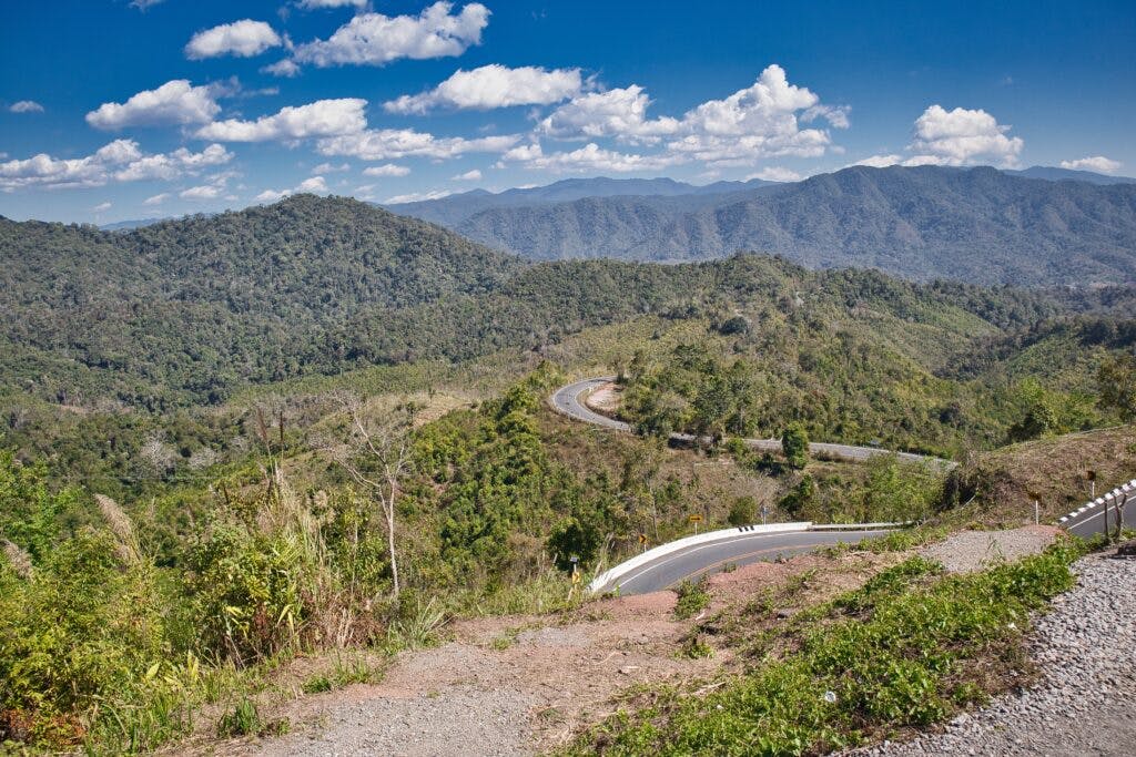 A road widing in the mountains, near Nan, Thailand.