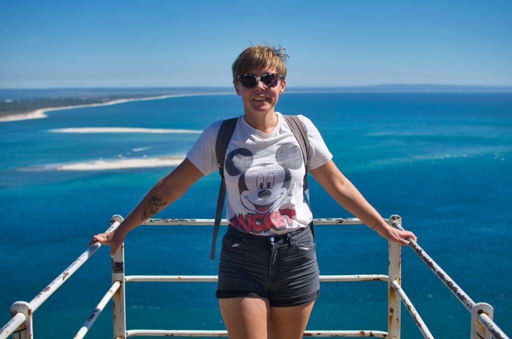 a woman standing at a view point in Portugal