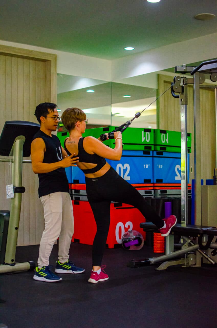A woman and a man exercising at the gym at Absolute Sanctuary, Koh Samui.