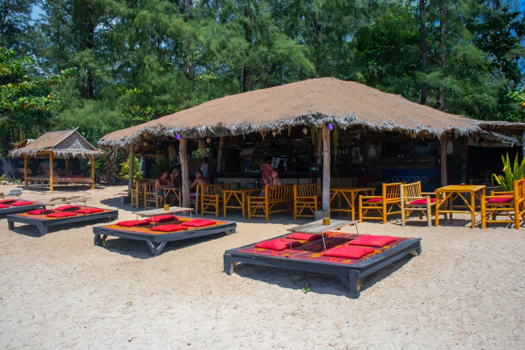 A bar with tables on the beach on koh lanta.