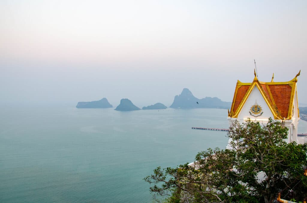 A temple on the hill overlooking the ocean.