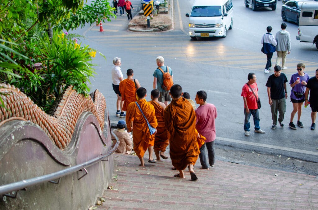 monks at a temple in chiang mai.