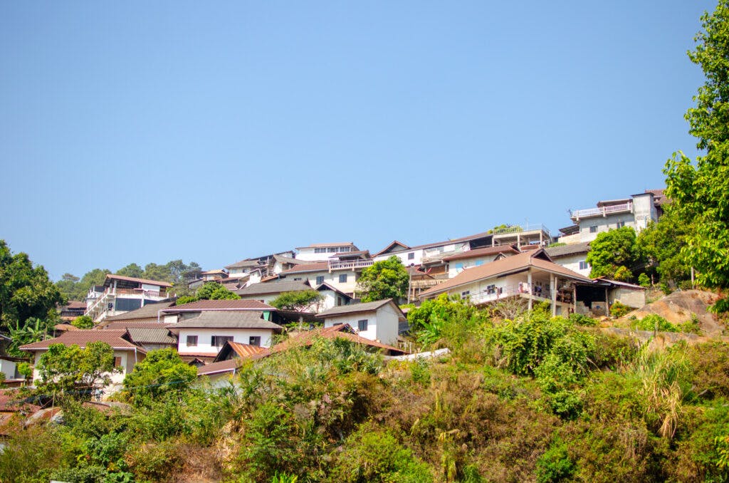 Small houses on a hill in Thailand. 
