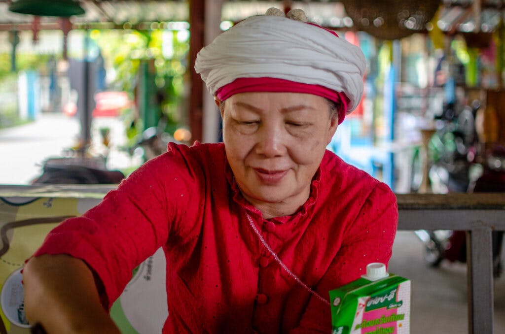 a lady with a white turban, thailand. 