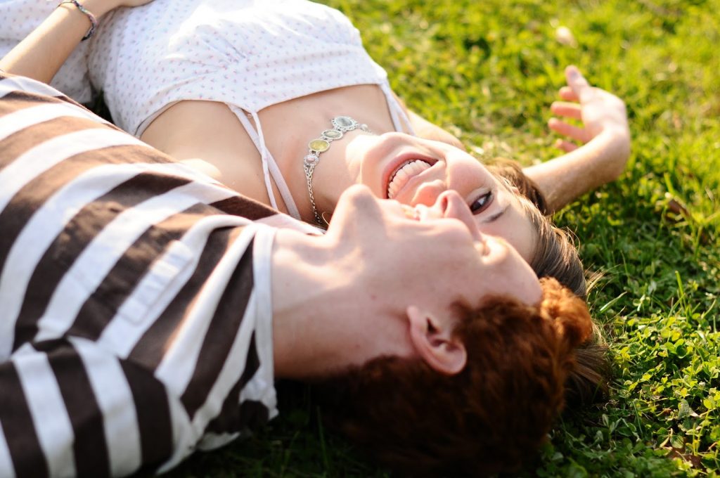 What’s more fun than laughing in the grass together? Photo thanks to Davey.