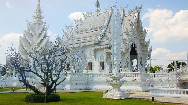 a white temple in chiang rai seen from the outside