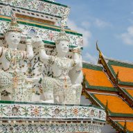 Beautiful, white buddha statues at Wat Arun in Bangkok