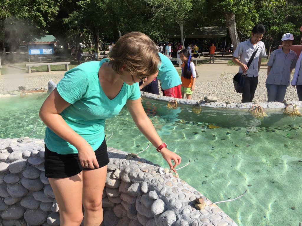 Joanna preparing to boil eggs in hot water from the San Kamphaeng Hot Springs