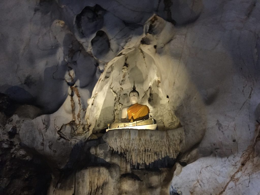 Sitting Buddha statue inside the Muang On Cave