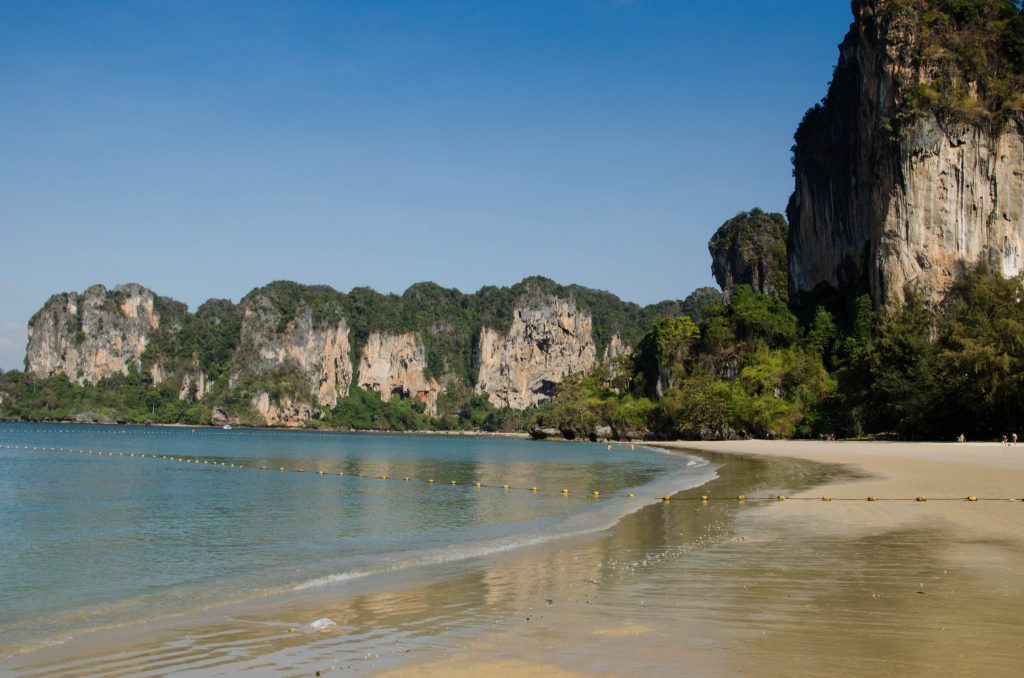 Railay Beach is famous for being surrounded by tall limestone cliffs