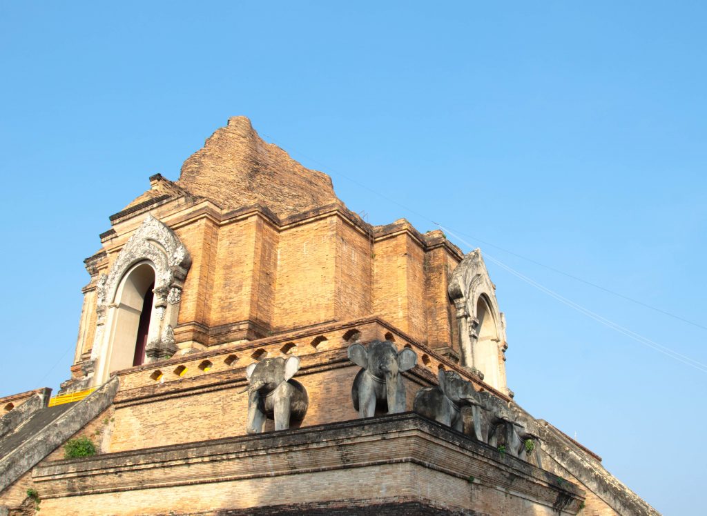 The chedi was built in the 15th century and its ruins can be found behind the main temple building