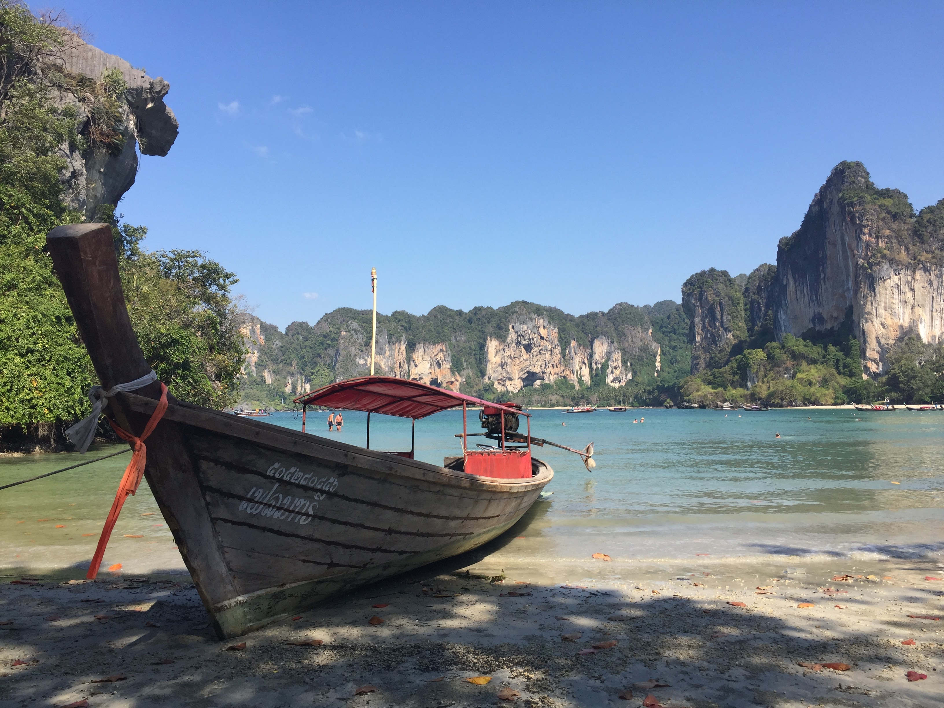 Railay Beach Krabi Thailand, a couple of men and woman on the