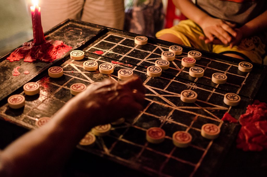 Men playing a game of traditional Chinese chess