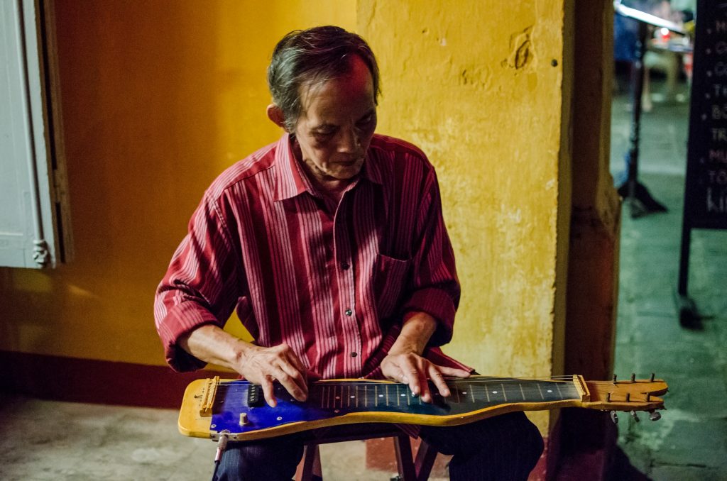 Street musician with traditional string instrument
