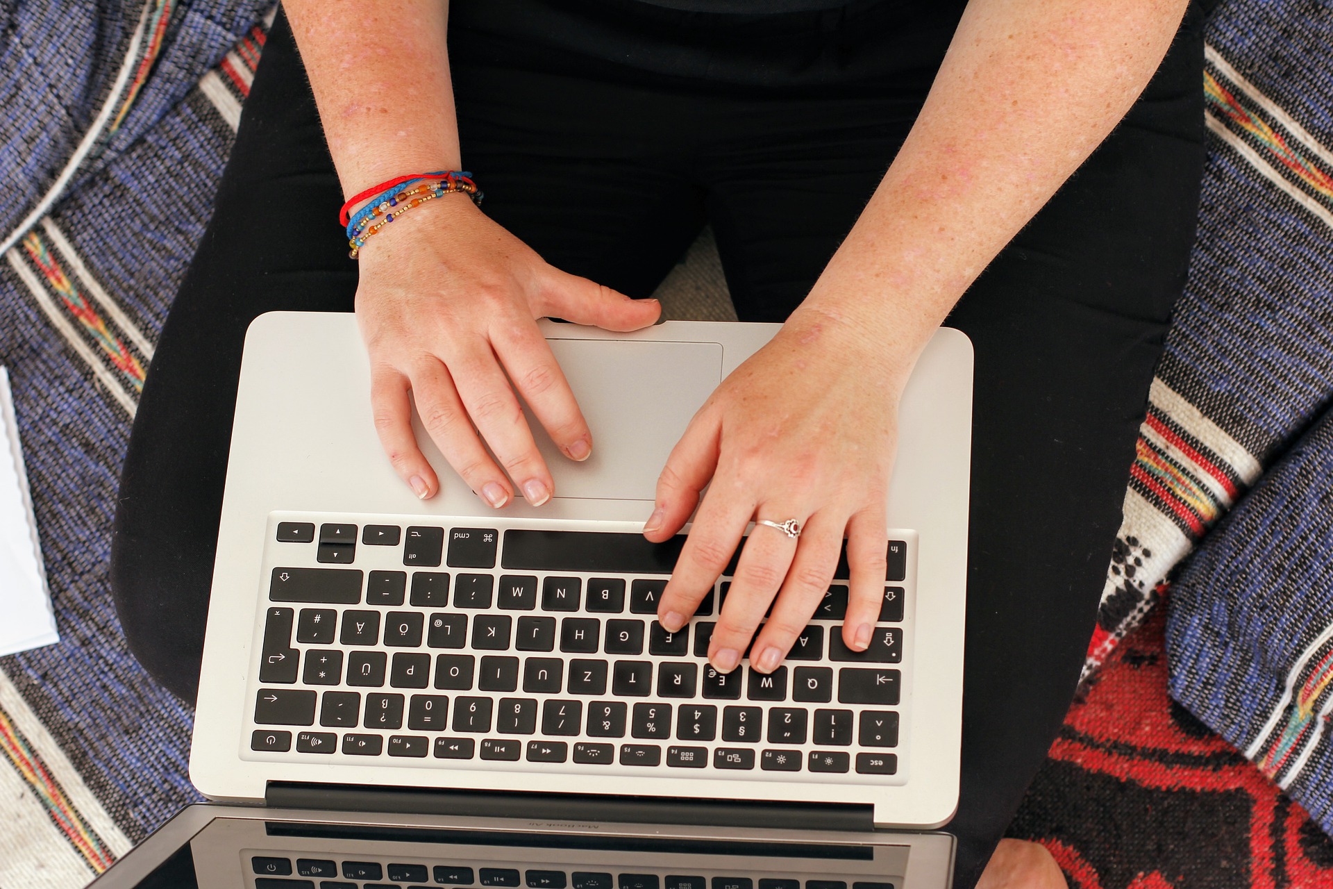 digital nomad writing on a computer