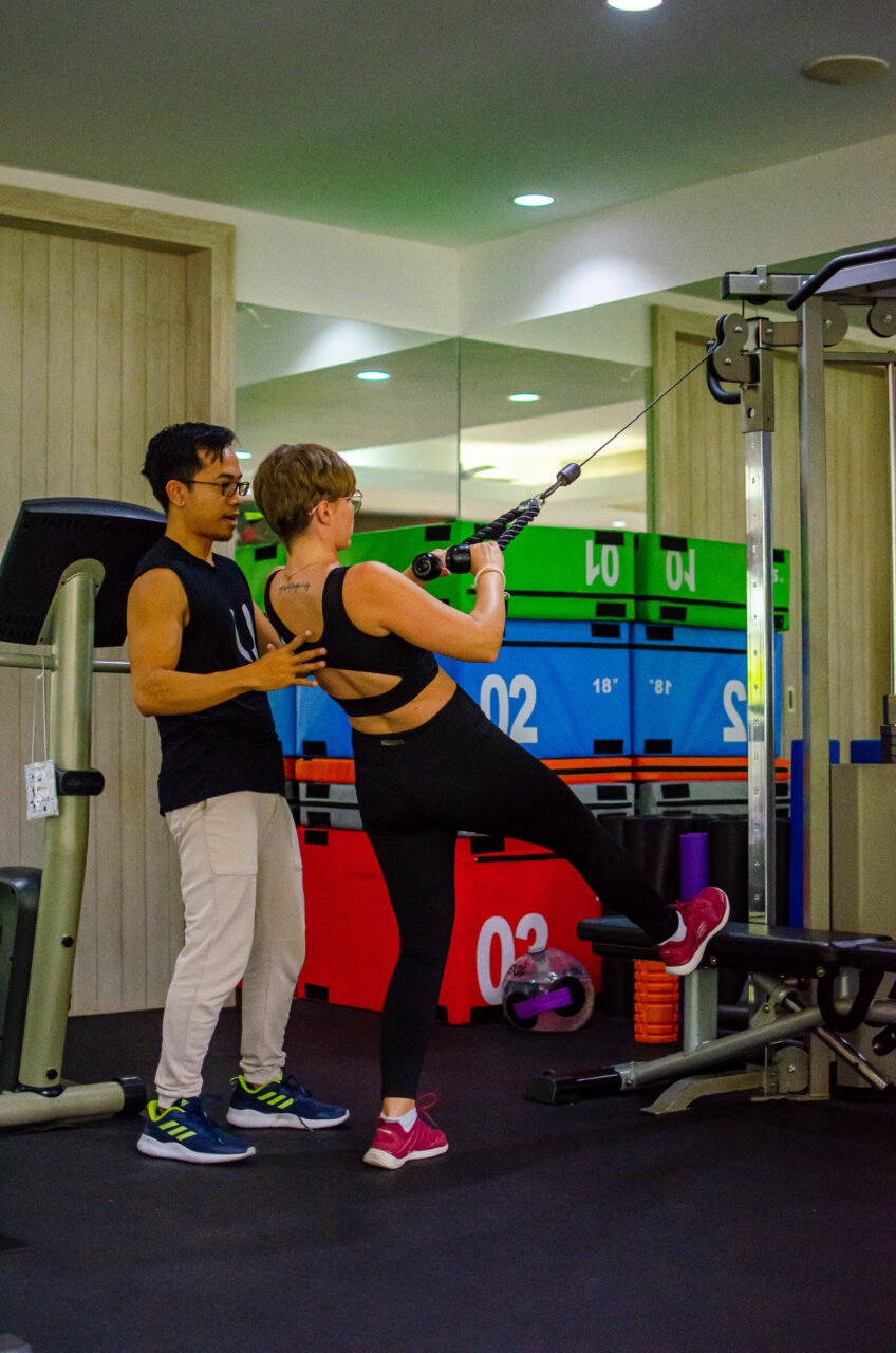 A woman and a man exercising at the gym at Absolute Sanctuary, Koh Samui.